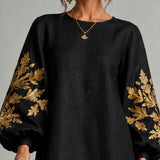 Black Mini Dress with Lantern Sleeves and Gold Pattern